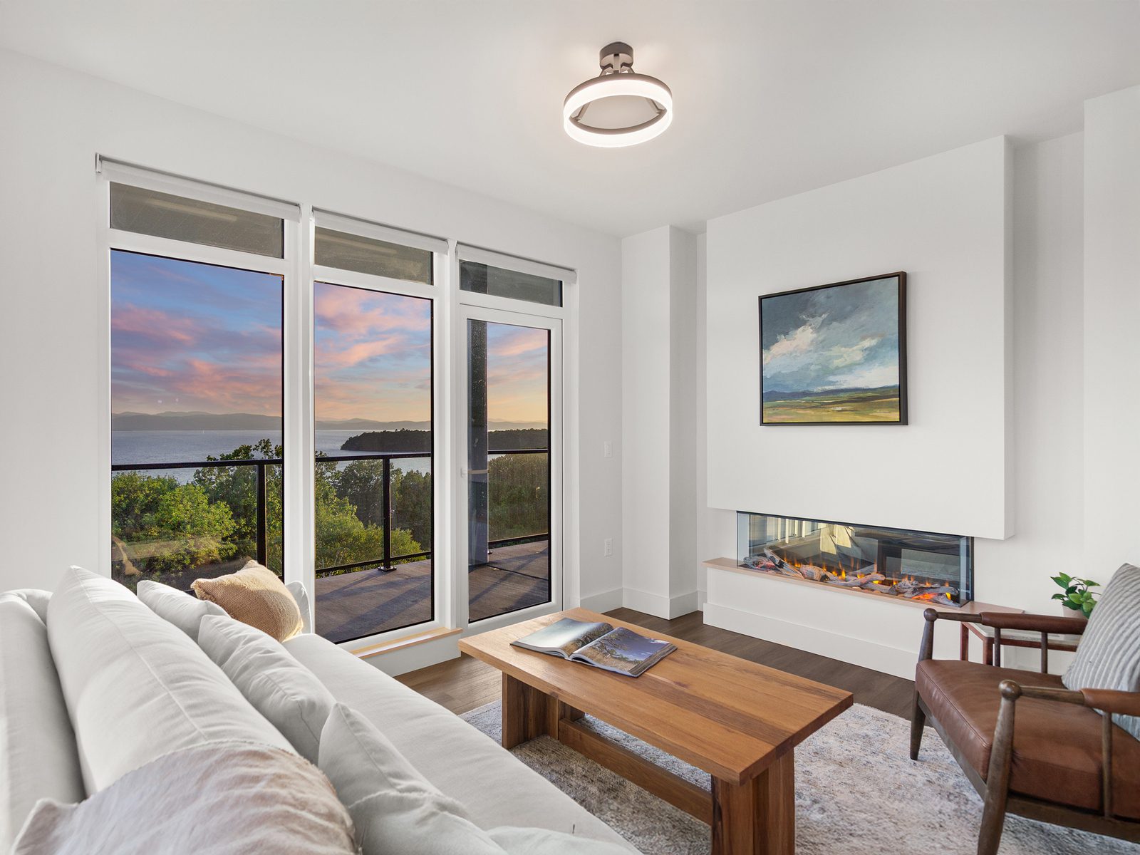 Living room with fireplace and lake view